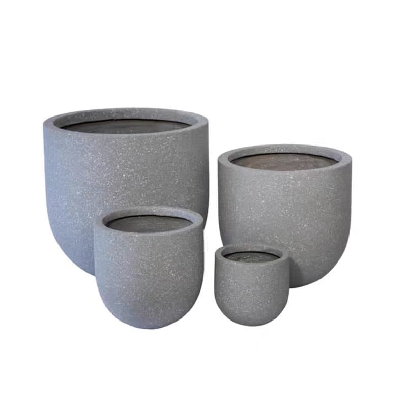 Family of Luban rotomoulded stone-finish planters in varied silhouettes